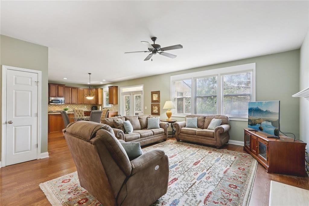 4460 Granby Circle Cumming, GA 30041 - Photo 13 of 34 a living room with furniture ceiling fan and a rug
