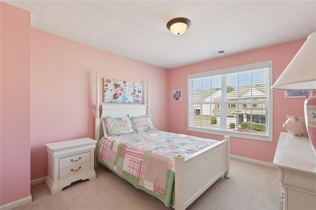 4460 Granby Circle Cumming, GA 30041 - Photo 21 of 34 a bedroom with a bed and a window