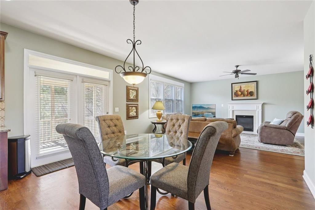 4460 Granby Circle Cumming, GA 30041 - Photo 8 of 34 a view of a dining room with furniture window and wooden floor