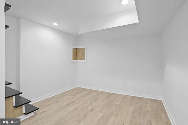 a view of hallway with wooden floor