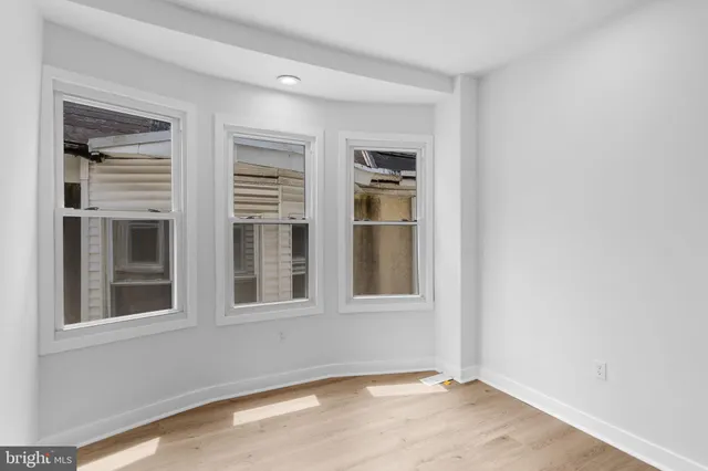 a bathroom with a toilet and a bathtub