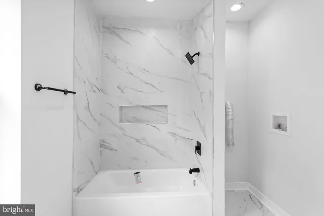 a view of a hallway with wooden shelves