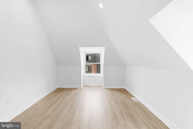 a front view of a house with lots of windows