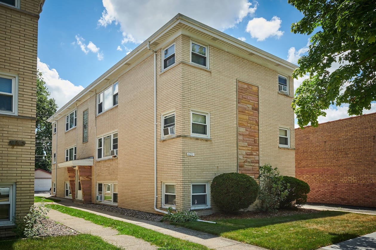 8211 West Irving Park Road Chicago, IL 60634 - Photo 1 of 28 a view of a house with a yard