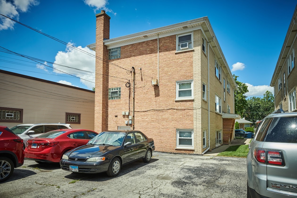 8211 West Irving Park Road Chicago, IL 60634 - Photo 28 of 28 a front view of a house with parking space