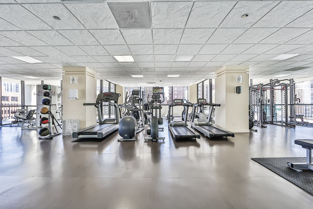 1122 North Clark Street, Unit 2806 Chicago, IL 60610 - Photo 18 of 20 a view of a room with lots of gym equipment