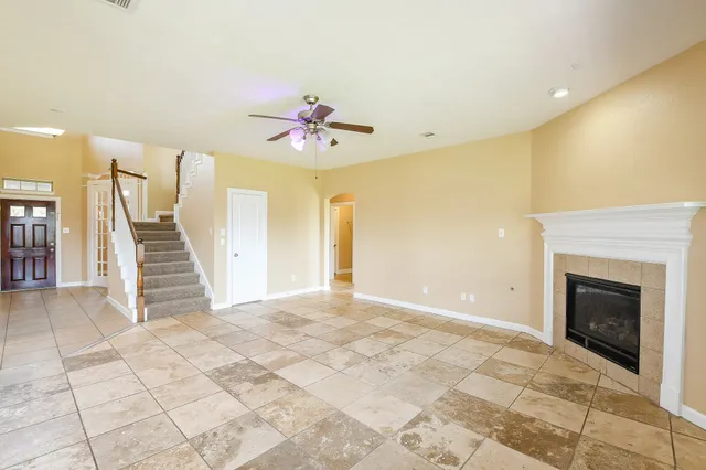 a view of an empty room with a fireplace