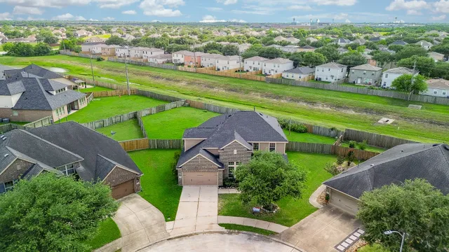 an aerial view of a house with a garden