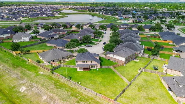 an aerial view of a house with a swimming pool yard and outdoor seating