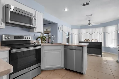 a kitchen with a stove and a microwave