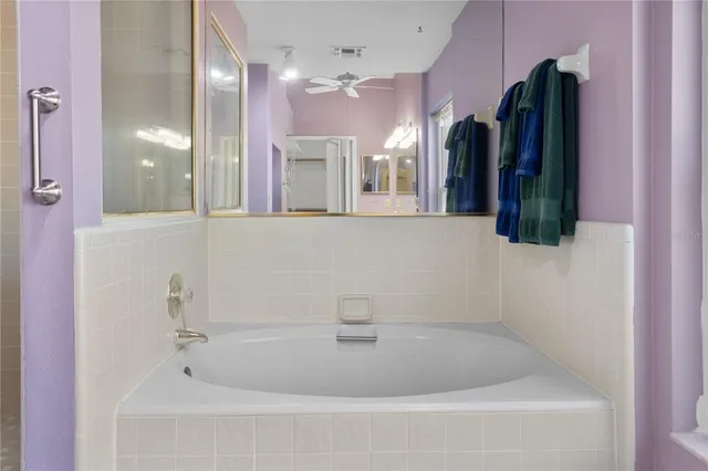 a bathroom with a bathtub and shower