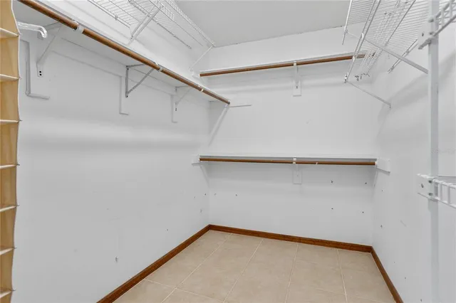 an empty room with a empty space and a window