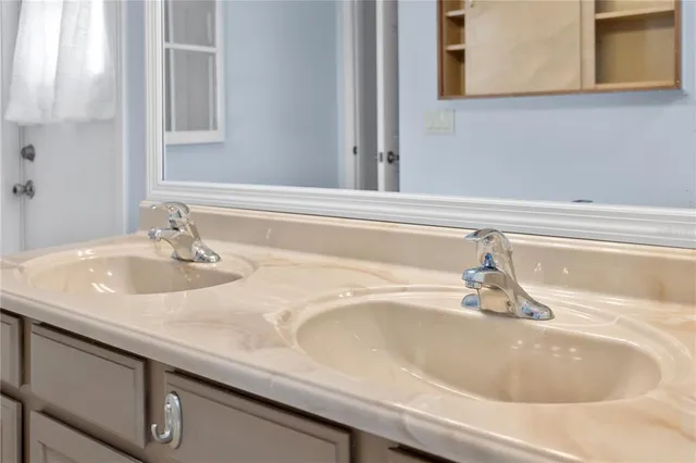 a bathroom with a window and a shower