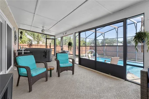 a view of a two chairs in the room and window