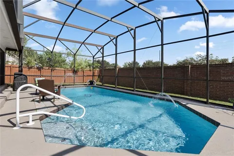 a view of a backyard with sitting area and furniture