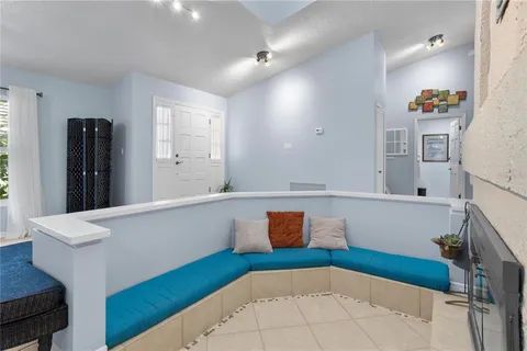 a view of living room with furniture and wooden floor