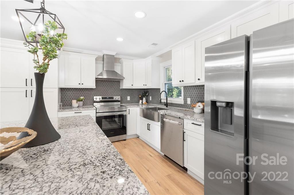 2606 Holbrook Road Fort Mill, SC 29715 - Photo 1 of 23 a kitchen with stainless steel appliances granite countertop a refrigerator a stove and a sink