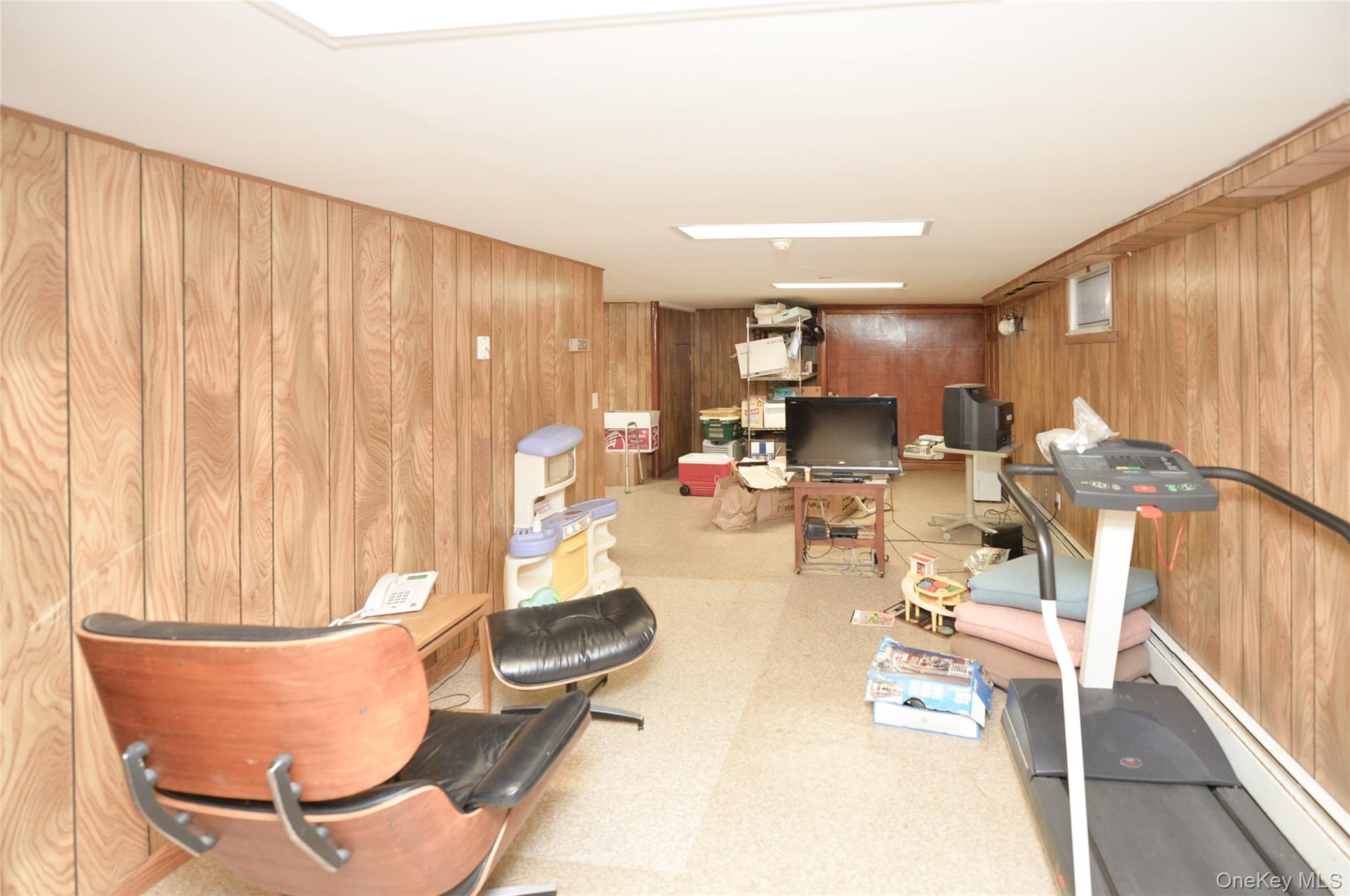 24 Highview Road Monsey, NY 10952 - Photo 35 of 44 a living room with dining table and chairs