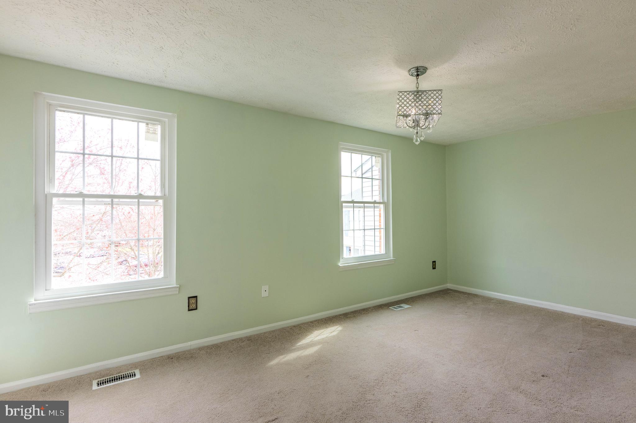 27 Cavan Green Nottingham, MD 21236 - Photo 16 of 31 an empty room with a window and ceiling fan
