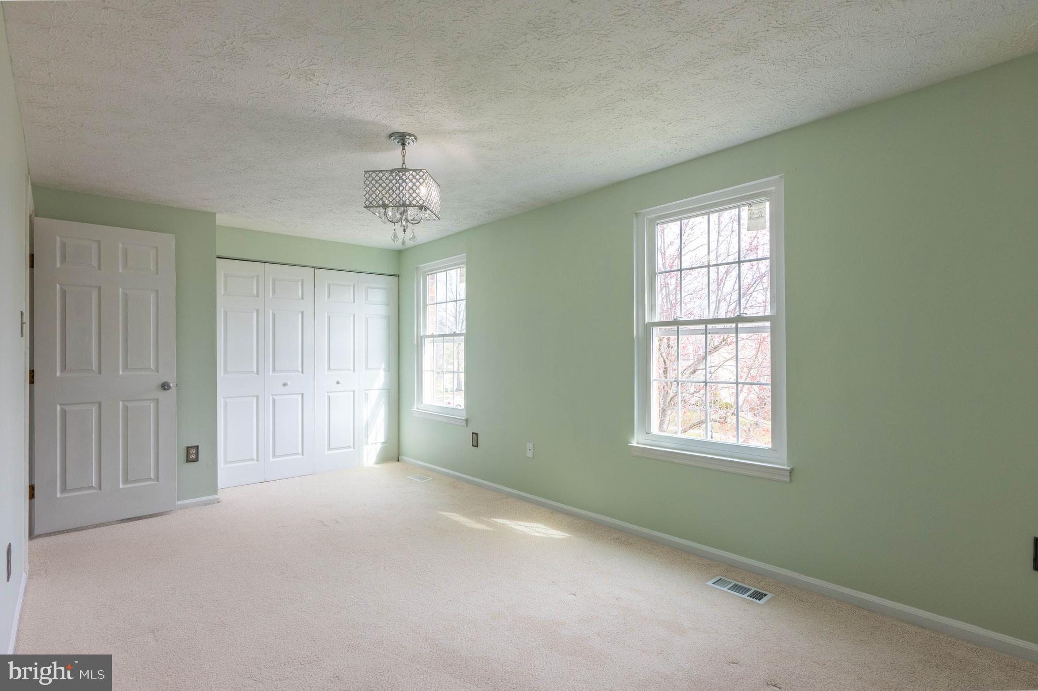 27 Cavan Green Nottingham, MD 21236 - Photo 17 of 31 an empty room with windows and cabinet