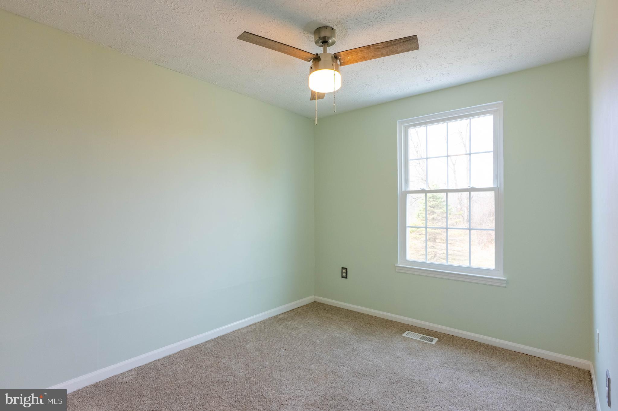 27 Cavan Green Nottingham, MD 21236 - Photo 20 of 31 an empty room with a window and a fan