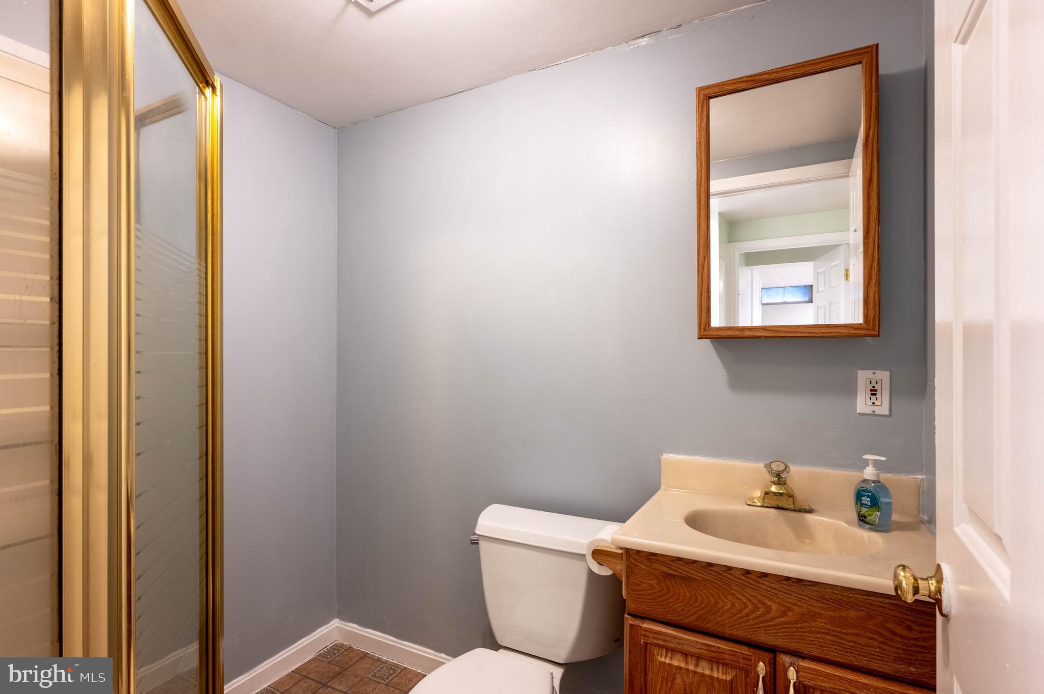 27 Cavan Green Nottingham, MD 21236 - Photo 25 of 31 a bathroom with a toilet sink and mirror