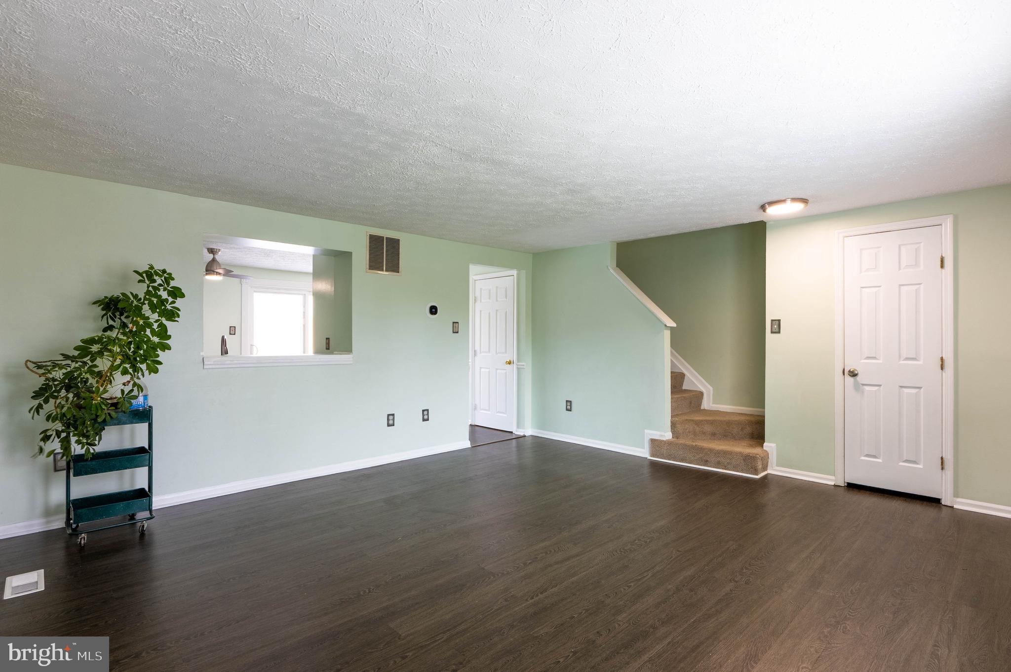 27 Cavan Green Nottingham, MD 21236 - Photo 7 of 31 an empty room with wooden floor and windows