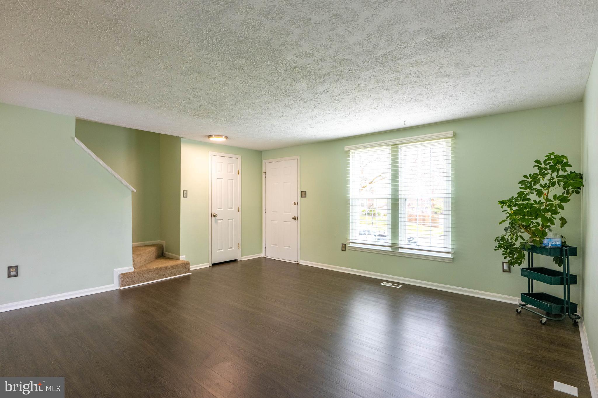 27 Cavan Green Nottingham, MD 21236 - Photo 8 of 31 an empty room with wooden floor and windows