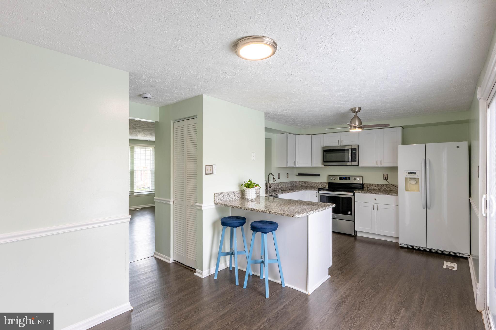 27 Cavan Green Nottingham, MD 21236 - Photo 10 of 31 a kitchen with stainless steel appliances a refrigerator and a stove top oven