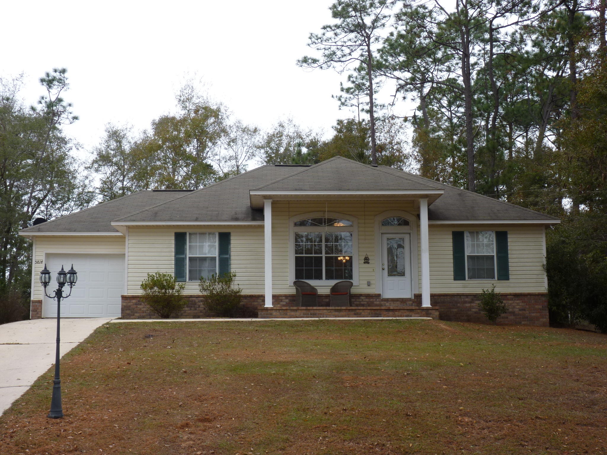 5814 Dairy Road Baker, FL 32531 - Photo 1 of 29 front view of a house with a patio