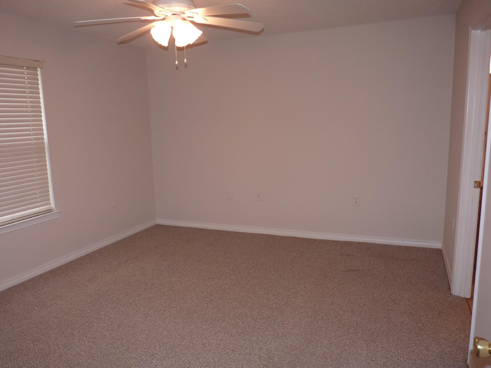 5814 Dairy Road Baker, FL 32531 - Photo 11 of 29 a view of an empty room with a chandelier fan