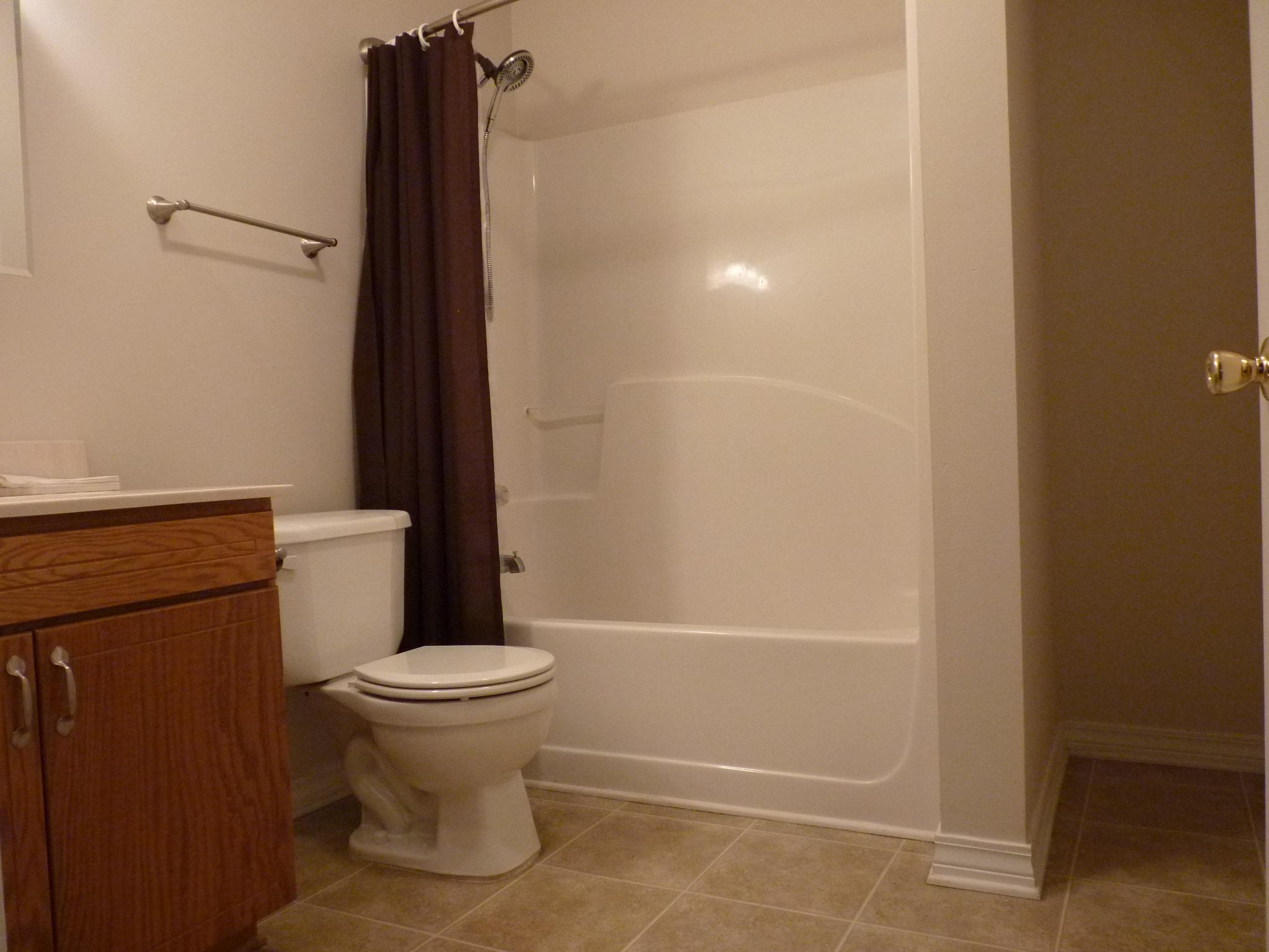 5814 Dairy Road Baker, FL 32531 - Photo 14 of 29 a bathroom with a toilet and a shower