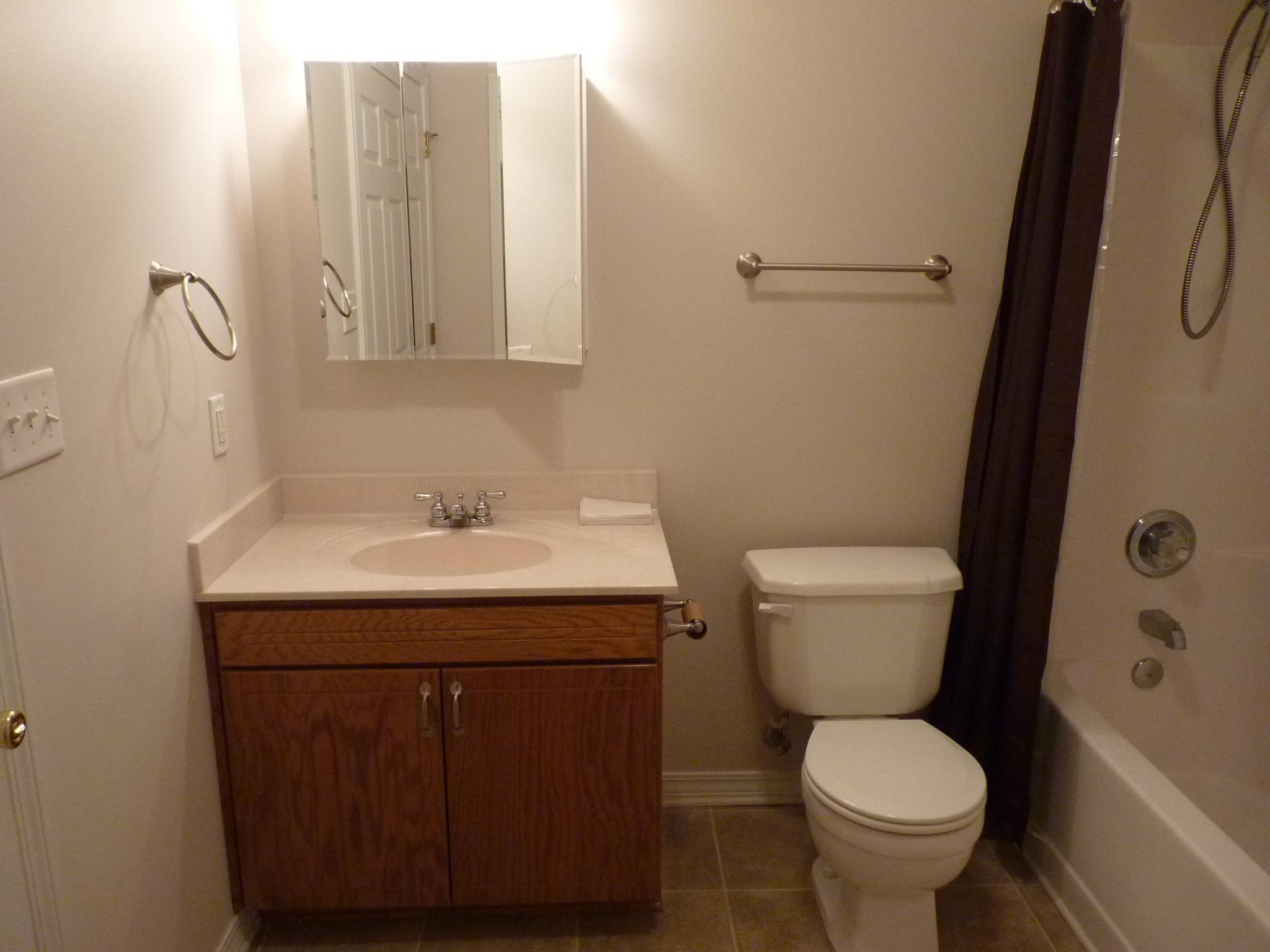 5814 Dairy Road Baker, FL 32531 - Photo 15 of 29 a bathroom with a sink toilet and shower