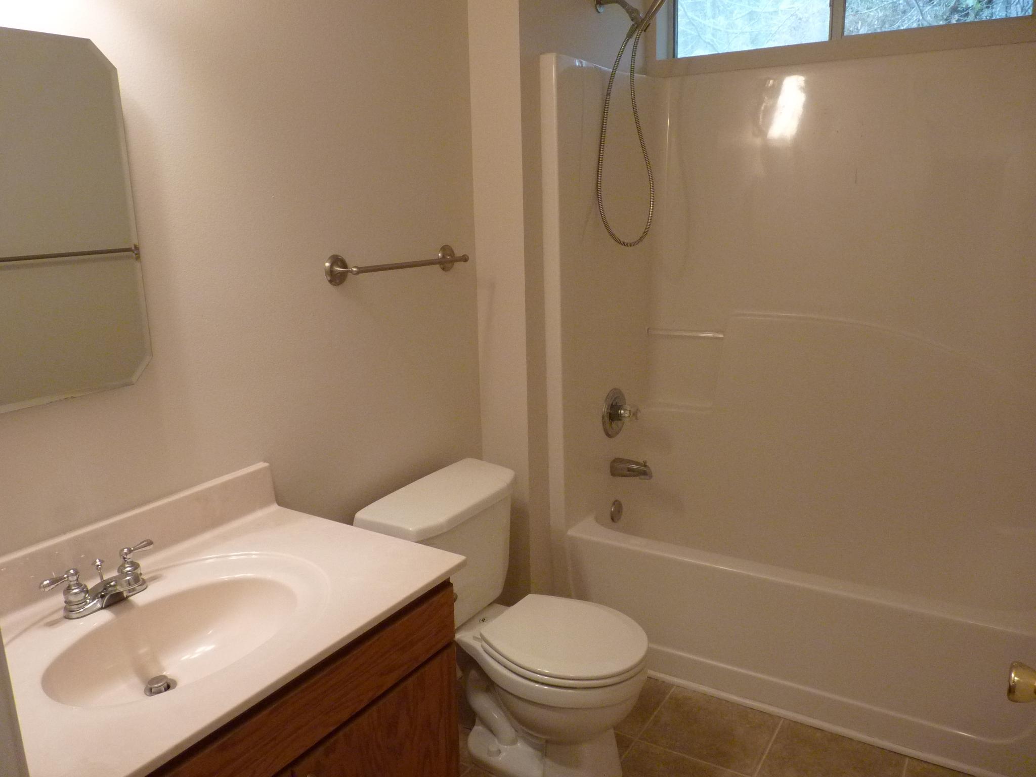 5814 Dairy Road Baker, FL 32531 - Photo 18 of 29 a bathroom with a sink toilet and shower