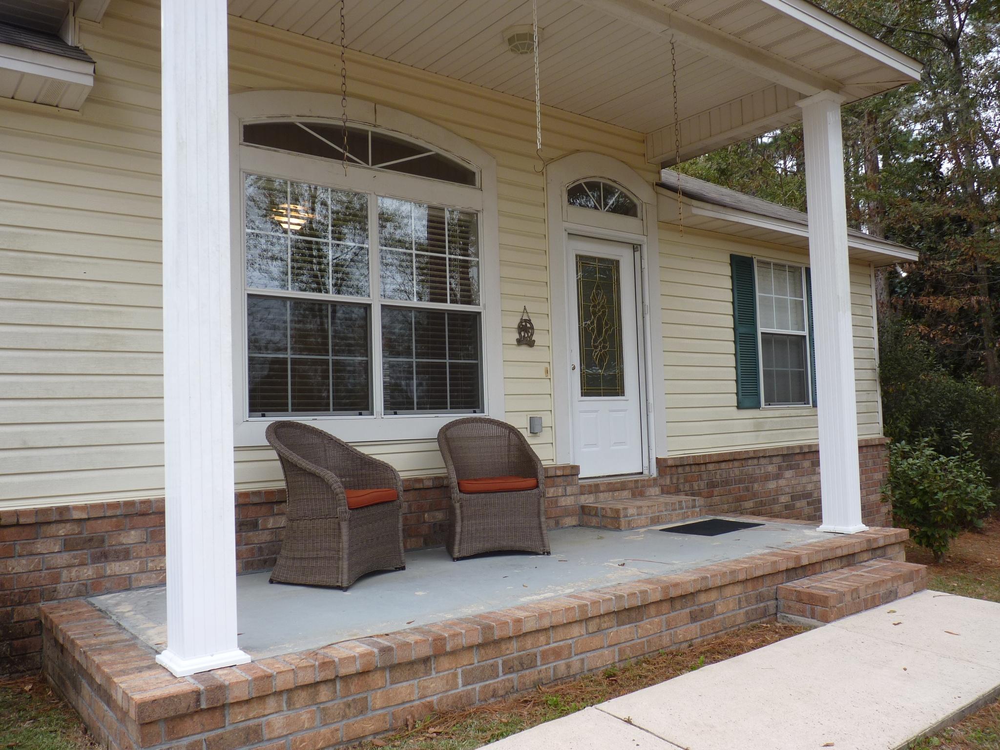 5814 Dairy Road Baker, FL 32531 - Photo 3 of 29 a front view of a house with windows