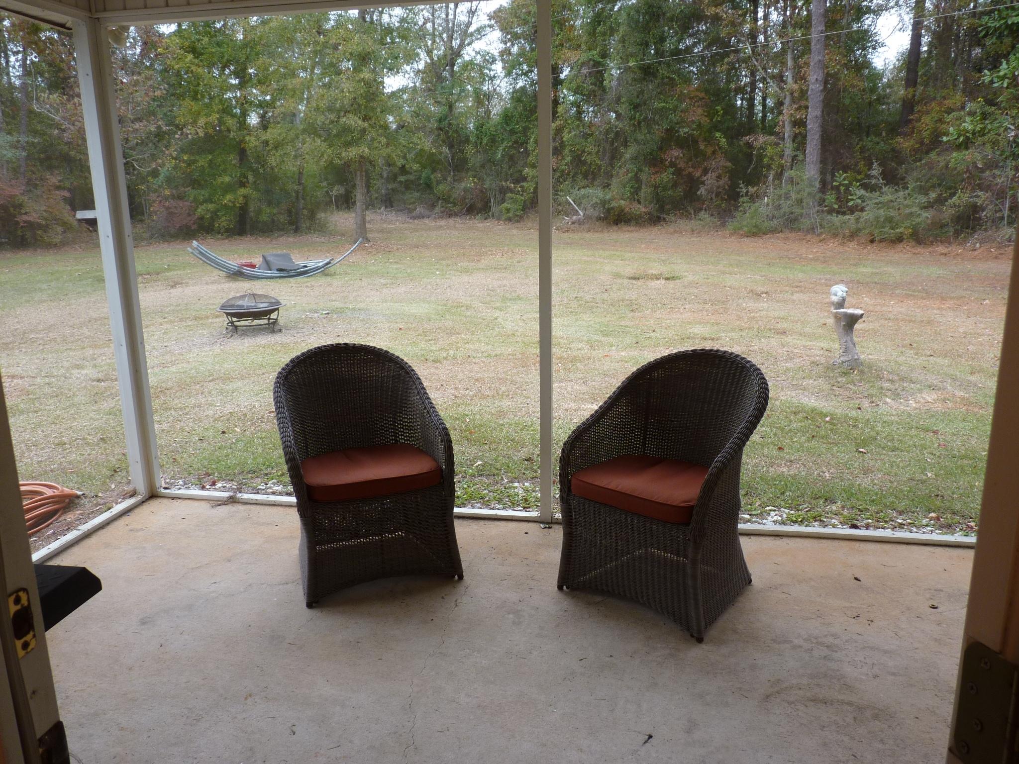 5814 Dairy Road Baker, FL 32531 - Photo 22 of 29 a backyard of a house with yard fire pit and outdoor seating