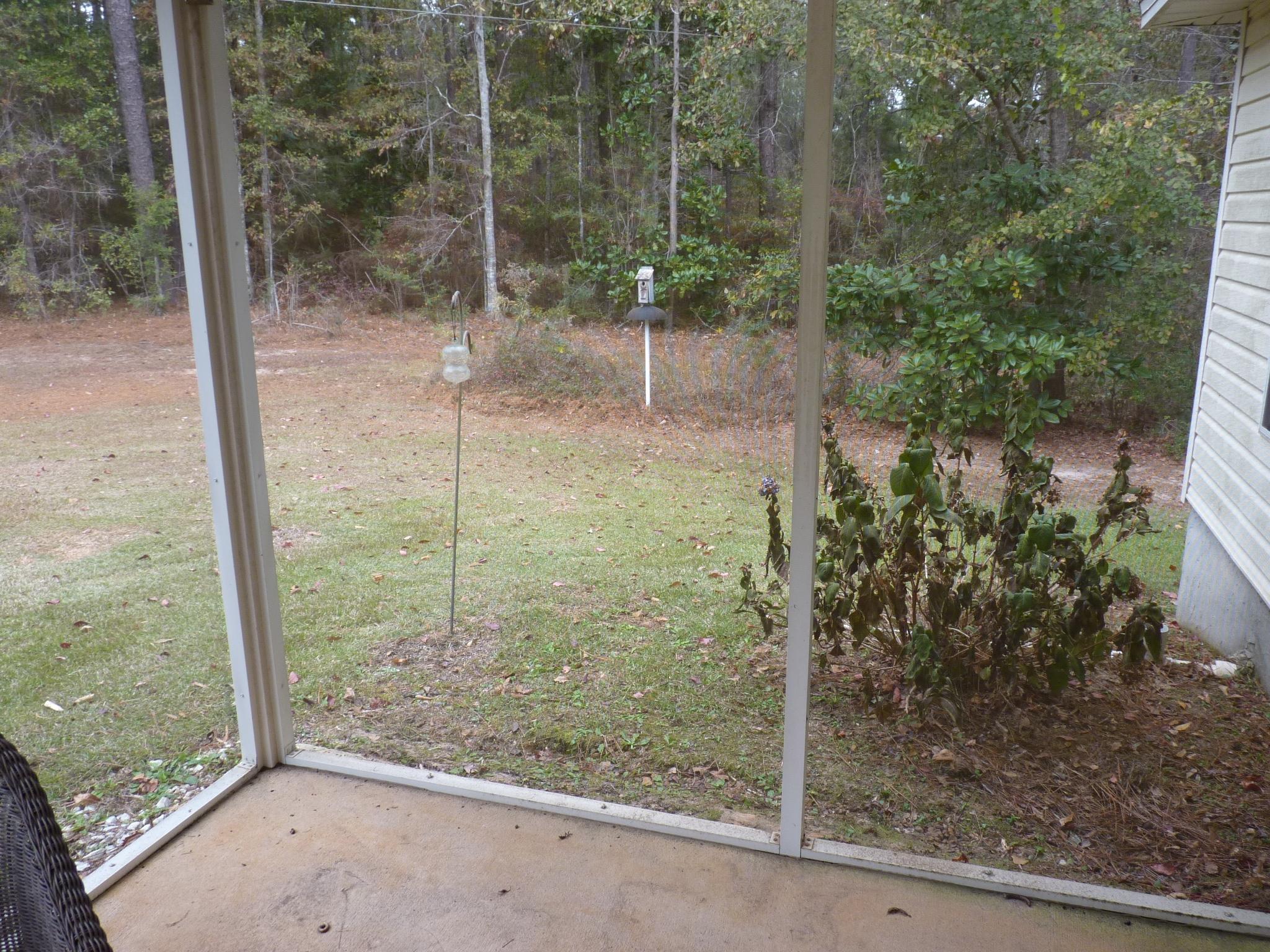 5814 Dairy Road Baker, FL 32531 - Photo 23 of 29 a view of a glass door and a window