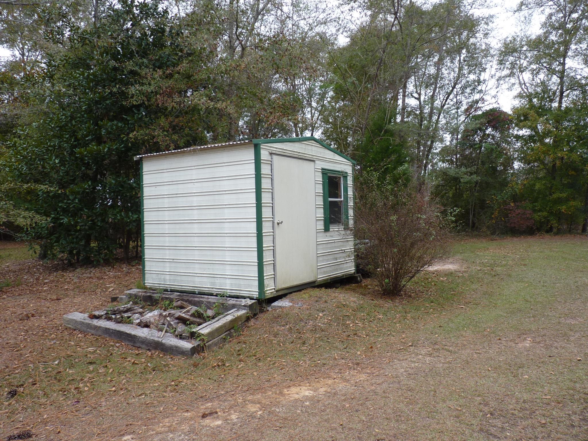5814 Dairy Road Baker, FL 32531 - Photo 25 of 29 a front view of a house with a yard
