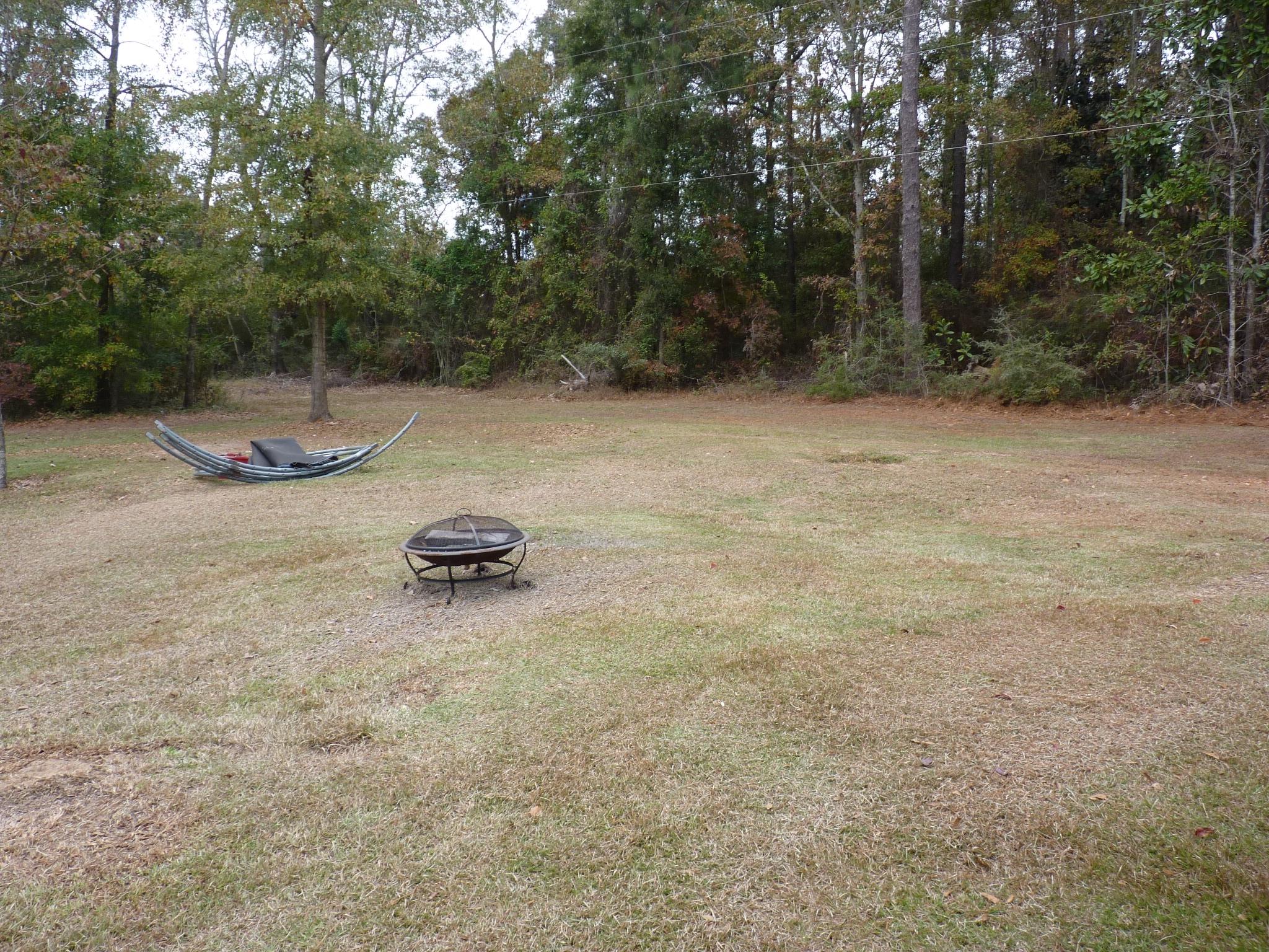 5814 Dairy Road Baker, FL 32531 - Photo 27 of 29 a backyard of a house with lots of green space