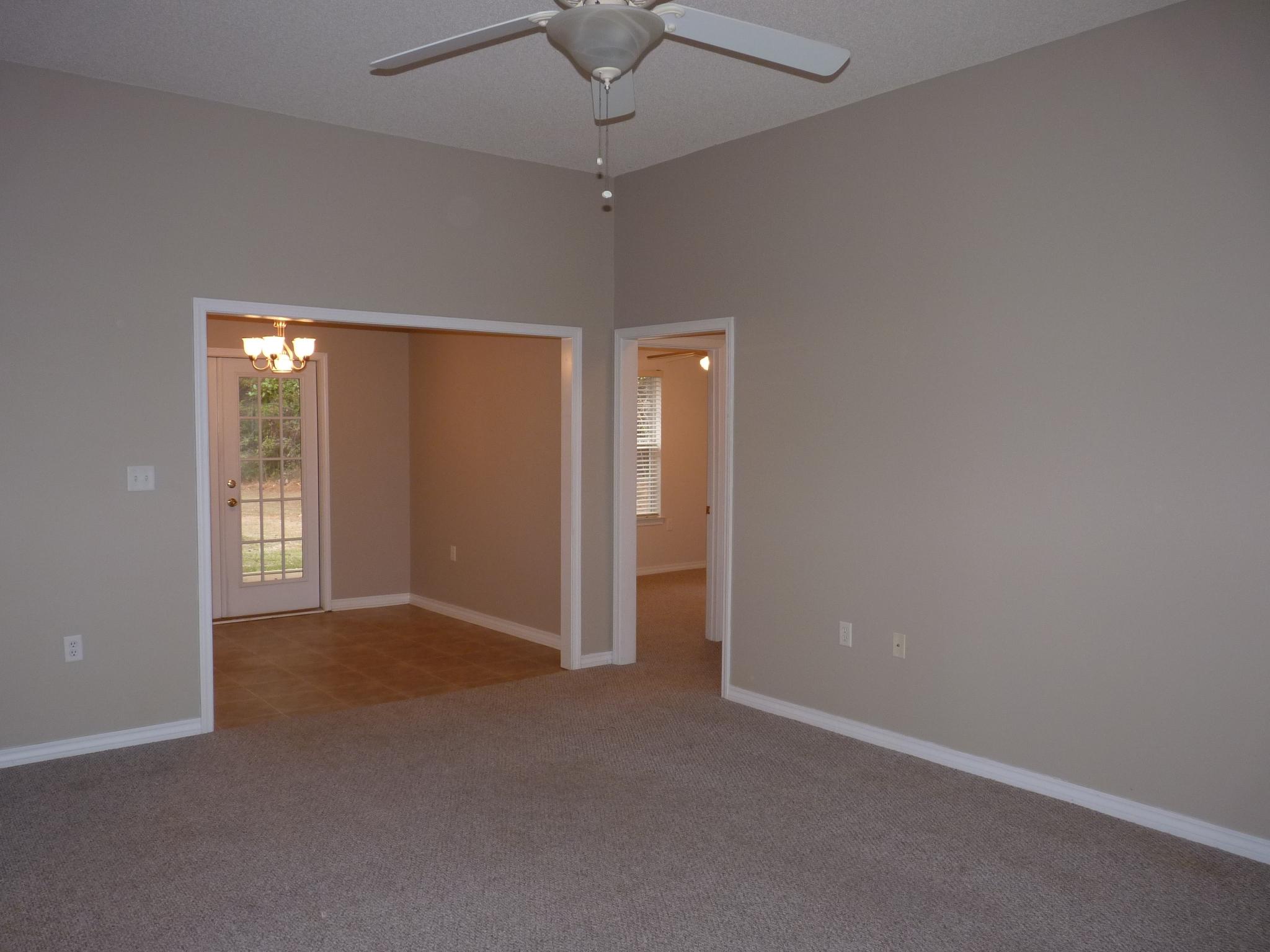 5814 Dairy Road Baker, FL 32531 - Photo 5 of 29 an empty room with chandelier fan and closet area