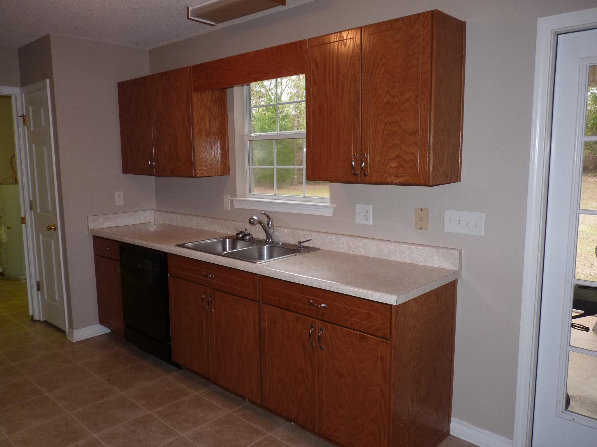 5814 Dairy Road Baker, FL 32531 - Photo 8 of 29 a bathroom with a sink and a mirror