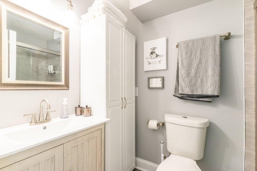 1944 Wilderness Parkway Jasper, GA 30143 - Photo 12 of 26 a bathroom with a toilet sink and mirror