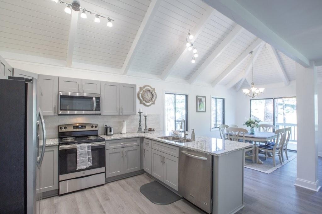1944 Wilderness Parkway Jasper, GA 30143 - Photo 6 of 26 a kitchen with sink a microwave and cabinets
