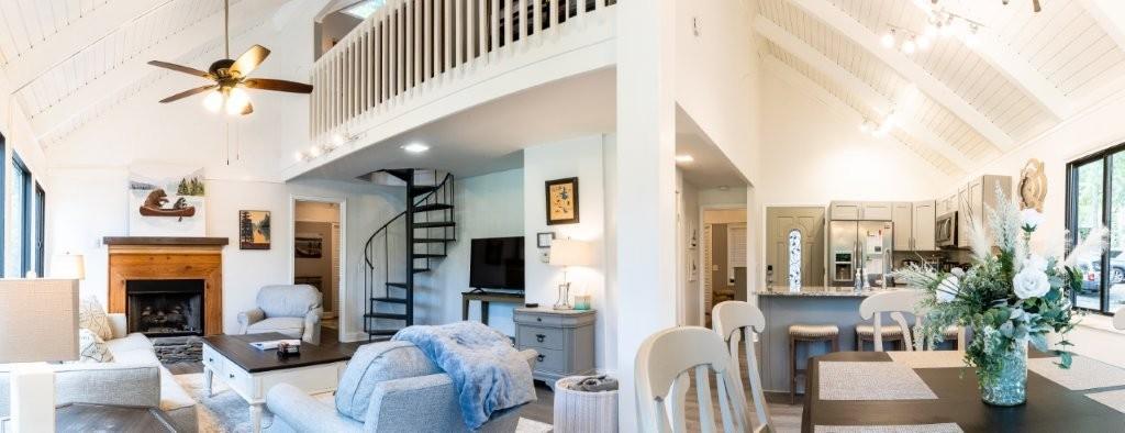 1944 Wilderness Parkway Jasper, GA 30143 - Photo 7 of 26 a living room with furniture a fireplace and a chandelier