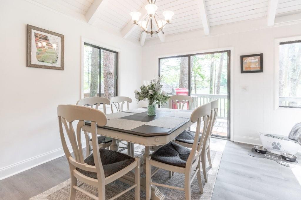 1944 Wilderness Parkway Jasper, GA 30143 - Photo 8 of 26 a view of a dining room with furniture window and wooden floor