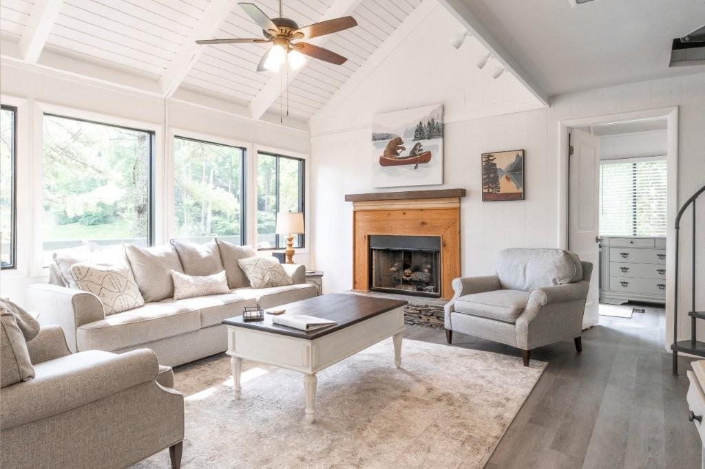 1944 Wilderness Parkway Jasper, GA 30143 - Photo 9 of 26 a living room with furniture and a fireplace