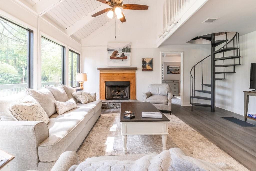 1944 Wilderness Parkway Jasper, GA 30143 - Photo 10 of 26 a living room with furniture fireplace and a large window