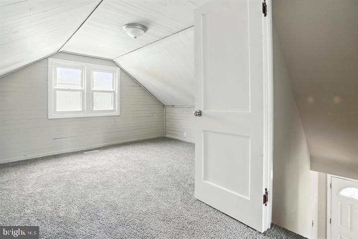 1239 Hilldale Road Baltimore, MD 21237 - Photo 11 of 13 an empty room with windows