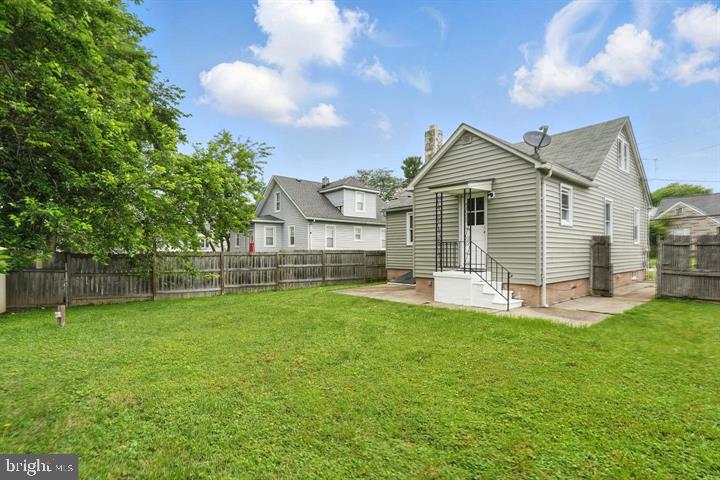 1239 Hilldale Road Baltimore, MD 21237 - Photo 13 of 13 a view of a house with a yard and sitting area