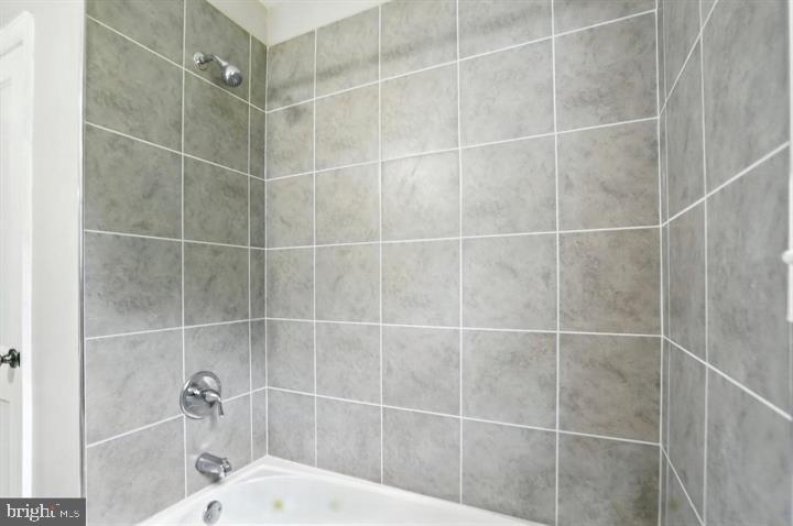 1239 Hilldale Road Baltimore, MD 21237 - Photo 8 of 13 a bathroom with a shower